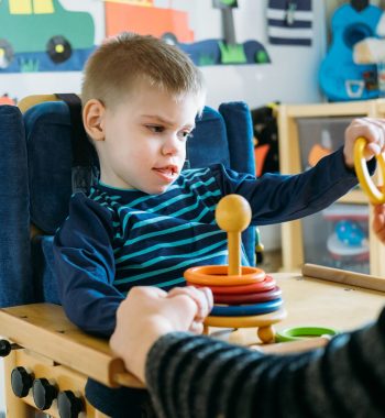 boy-playing-with-stacking-rings-toy-in-childcare-s-2026-03-23-23-00-18-utc (1)